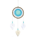 Attrape-rêves turquoise esprit élémentaire artisanal, favorisant la fluidité des émotions et la sérénité intérieure