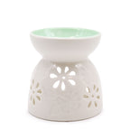 brûleur à huile en céramique blanche avec motifs floraux pour diffusion de parfum et ambiance relaxante