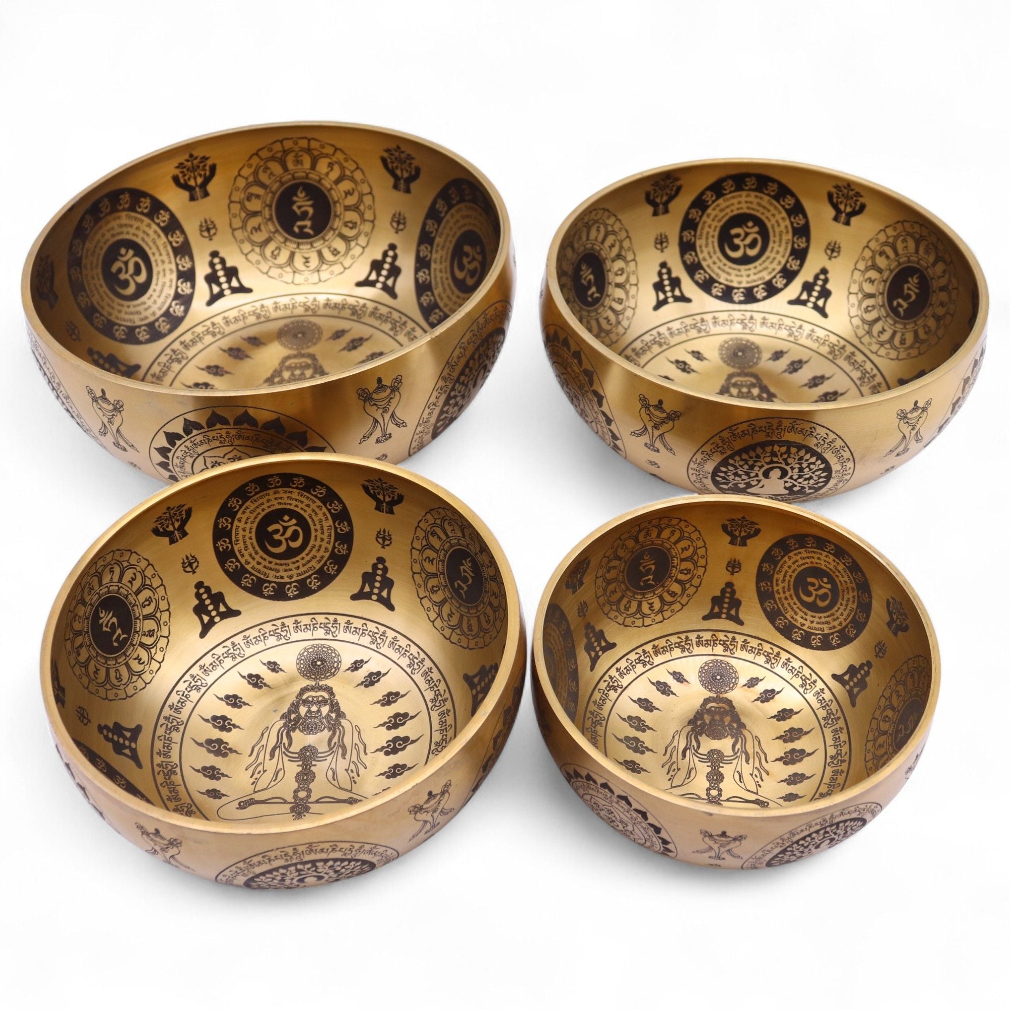 Ensemble de 4 bols chantants tibétains en laiton gravé avec motifs yogi et symboles spirituels