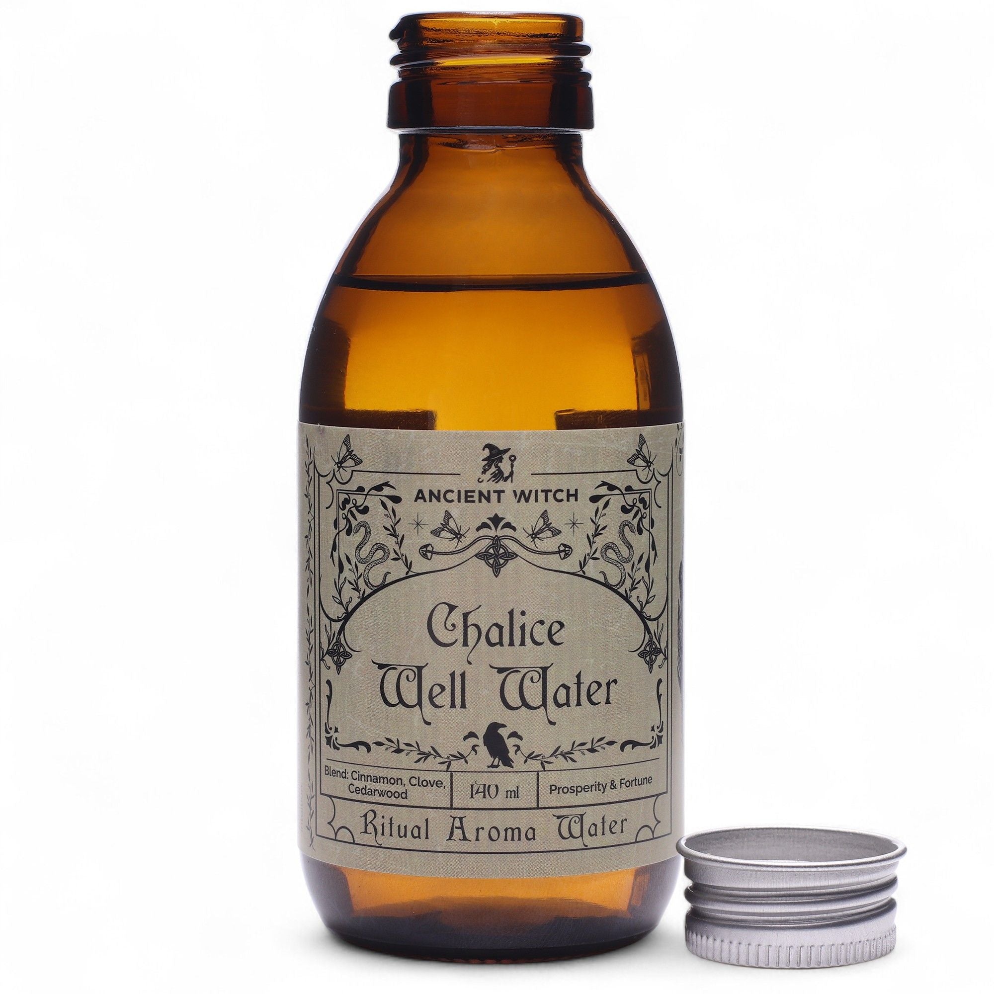 Eau rituelle Chalice Well Water en flacon ambré avec bouchon posé à côté, utilisée pour les rituels énergétiques et la revitalisation