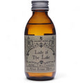 Flacon en verre ambré de l’eau rituelle dame du lac avec étiquette vintage, inspirée des rituels de purification