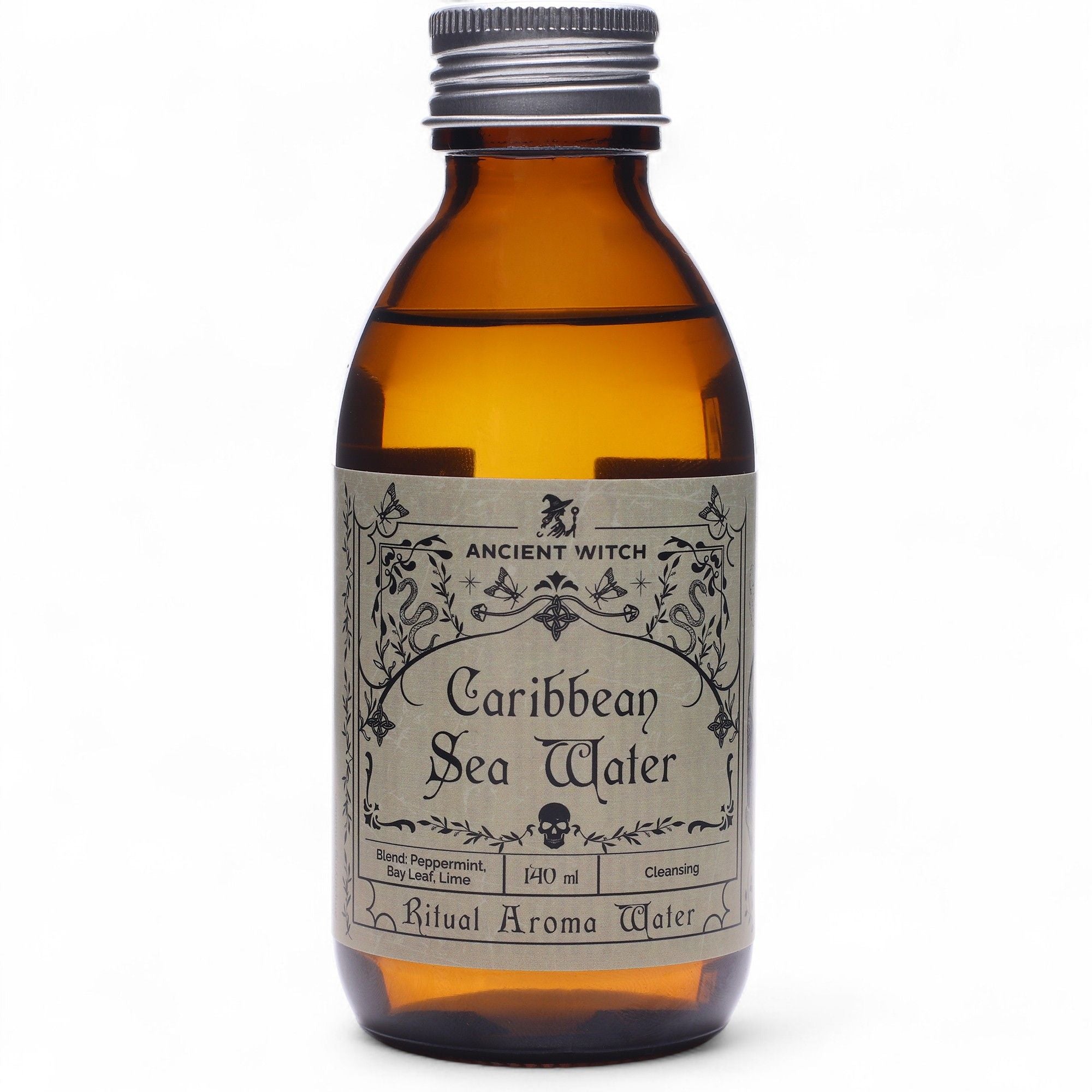 Flacon en verre ambré de l’eau rituelle mer des caraïbes avec étiquette vintage, inspirée des rituels de purification