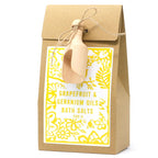 Sel de bain 500g pamplemousse et géranium présenté dans un sachet kraft avec étiquette jaune et cuillère en bois